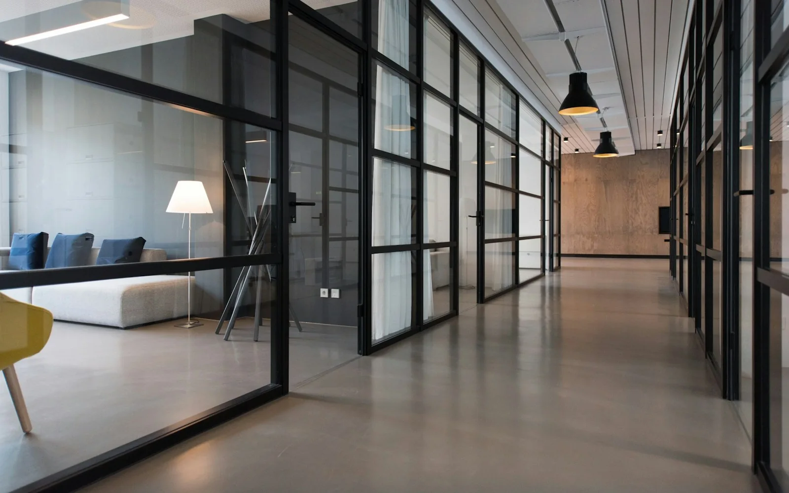 A contemporary professional workspace with glass partitions